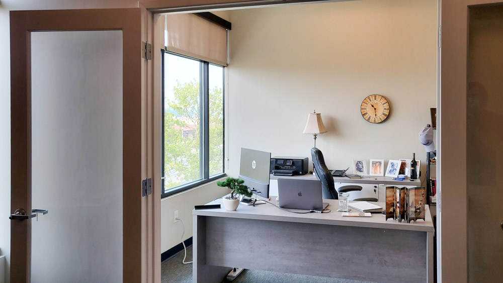 Sunny and light office space with light furniture