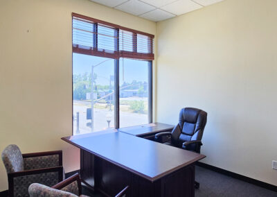 Office with large window, corner executive desk and two guest chairs at Gateway Executive Suites Lincoln CA