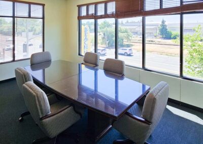 Bright conference room with large windows on two sides at Gateway Executive Suites Lincoln CA